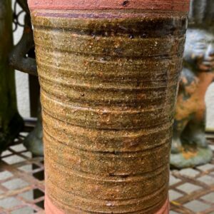 green ceramic cylinder vase.