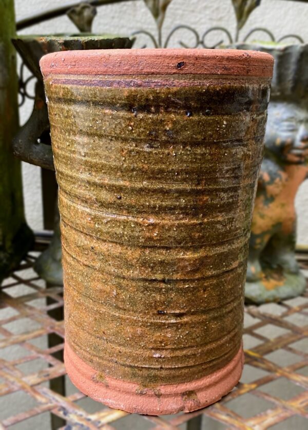green ceramic cylinder vase.
